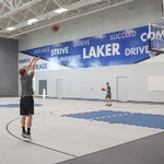 Guy shooting a jump shot on new basketball courts